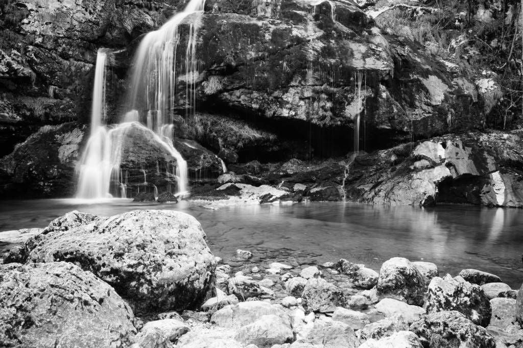 Waterfall over a stone wall 