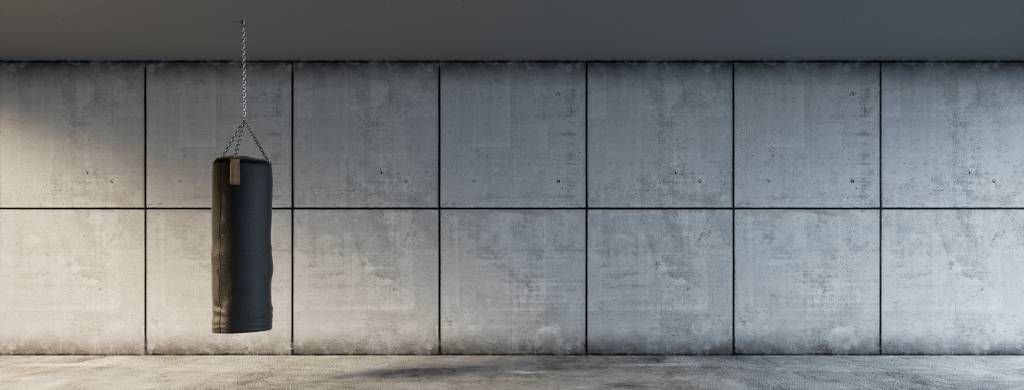 Punching bag with concrete background