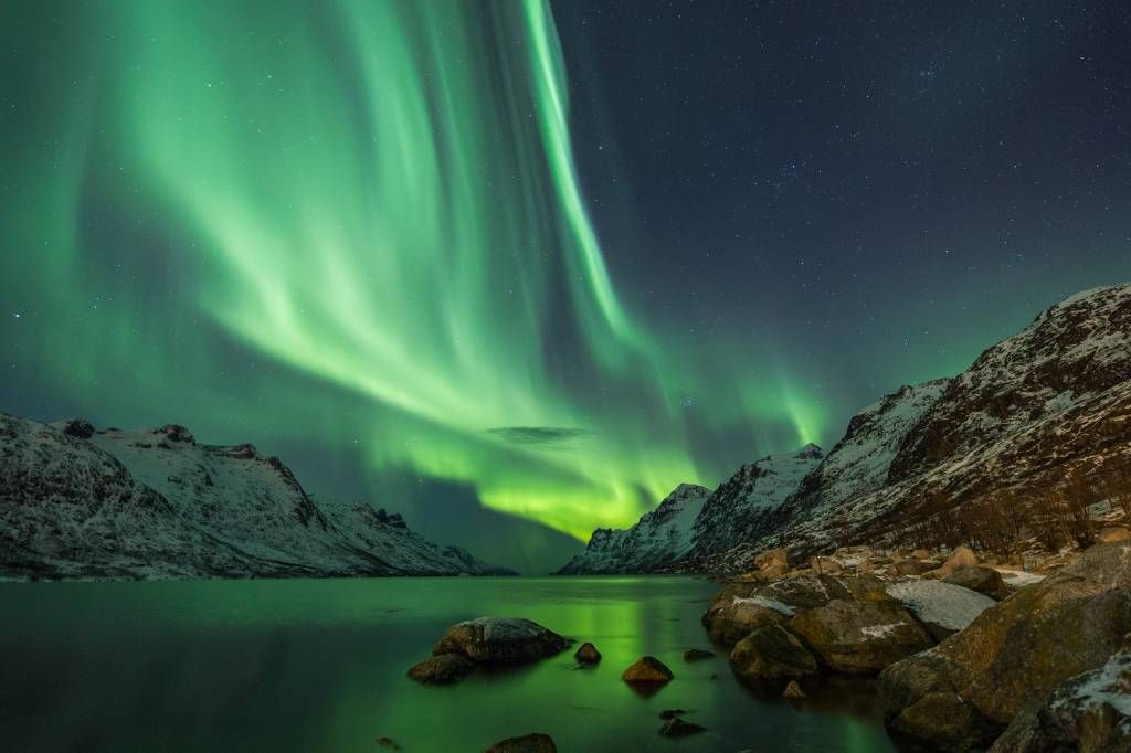 Northern lights between two fjords