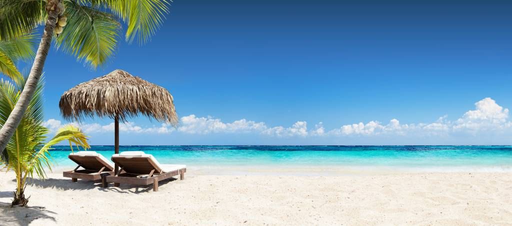 Chairs and parasol on tropical beach