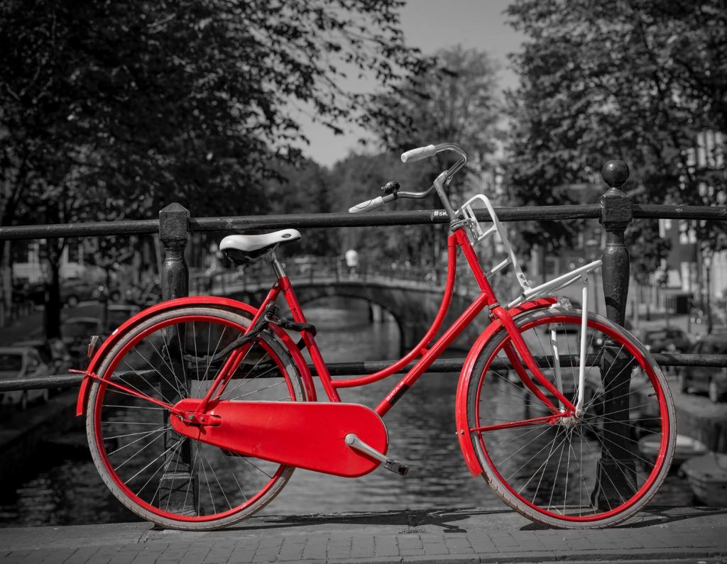 Red bike on bridge