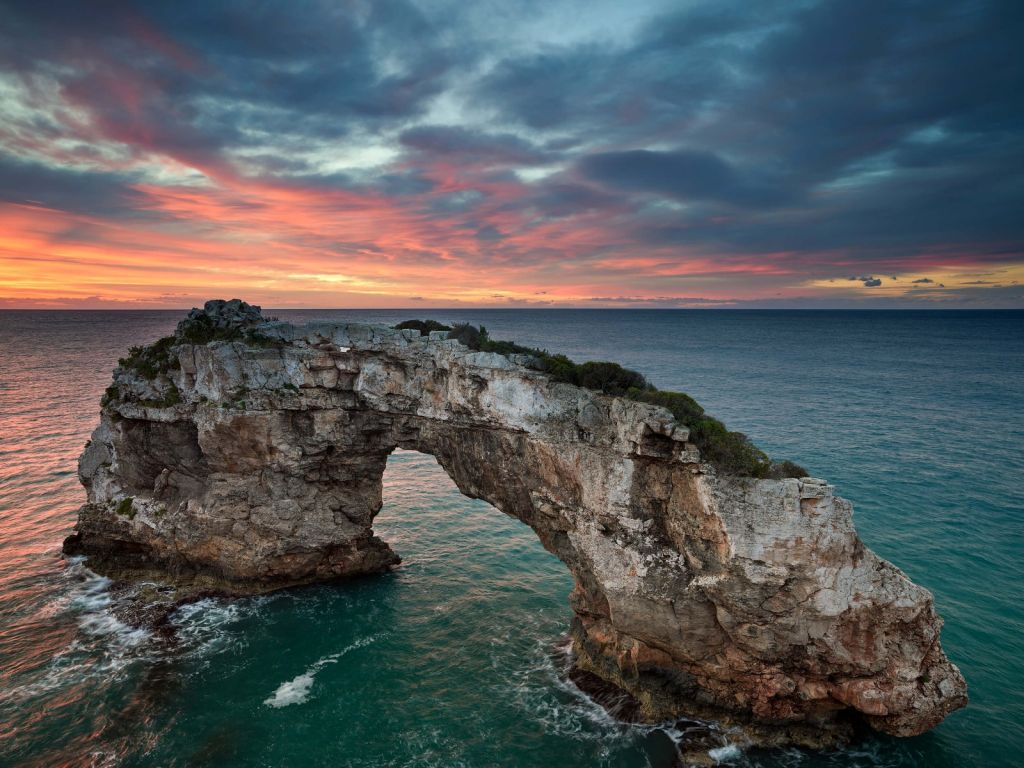 Curved rock in the sea