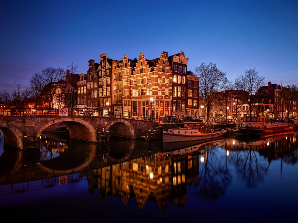 Illuminated houses along the canal