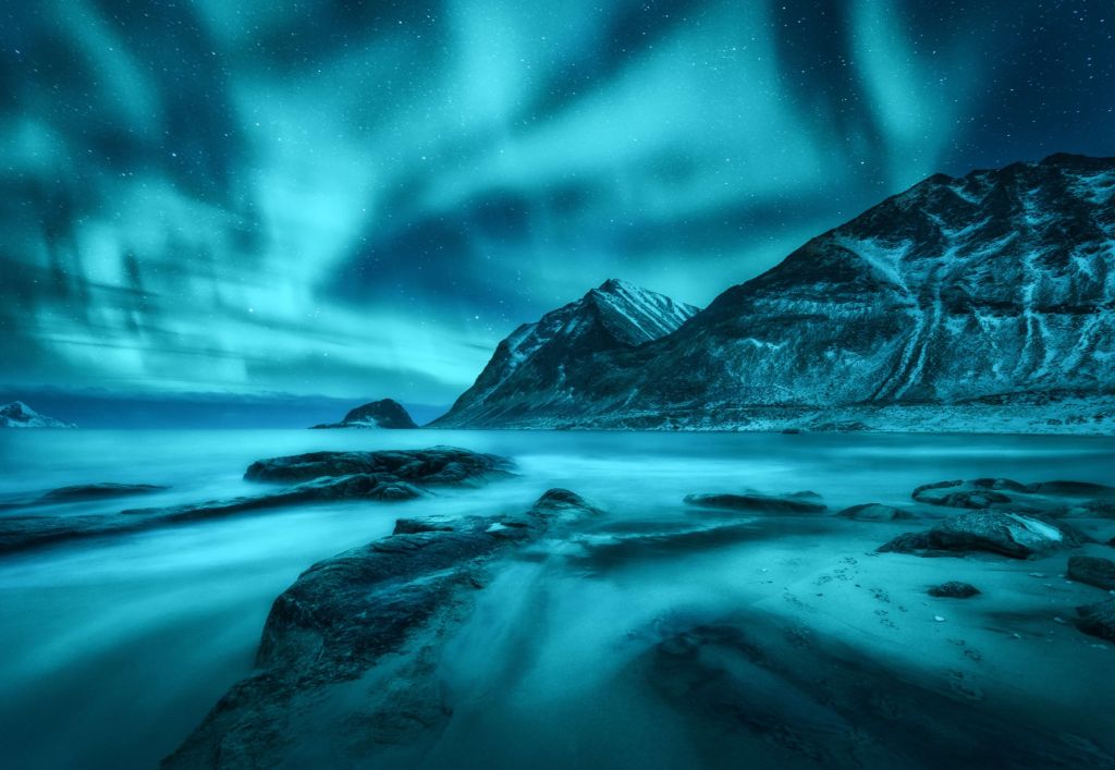 Blue northern lights with mountains