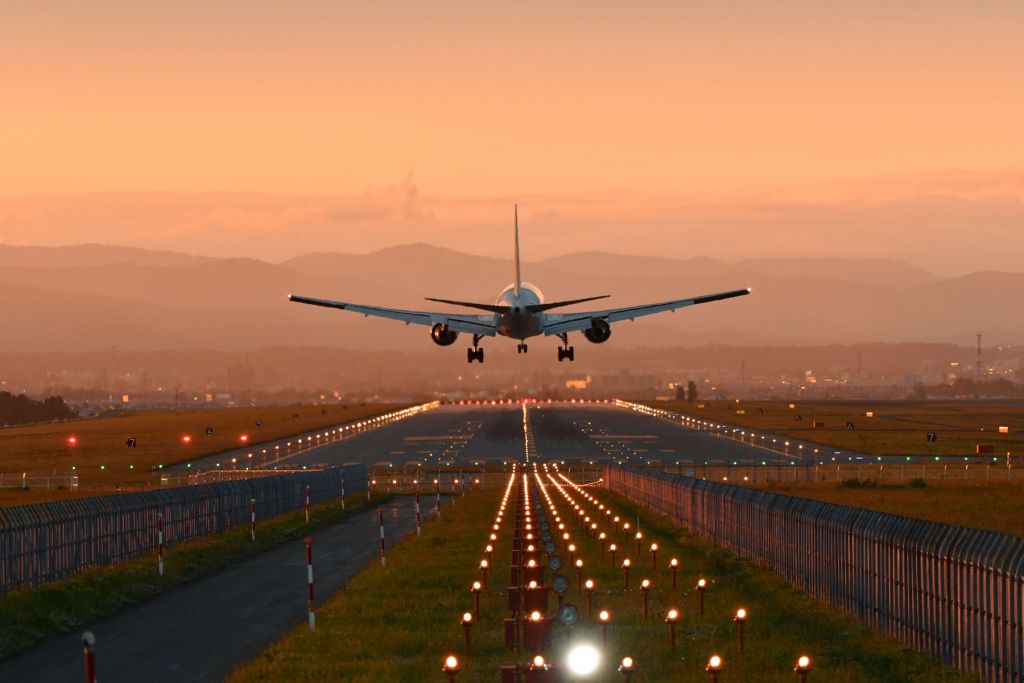 Landing plane in the evening sun