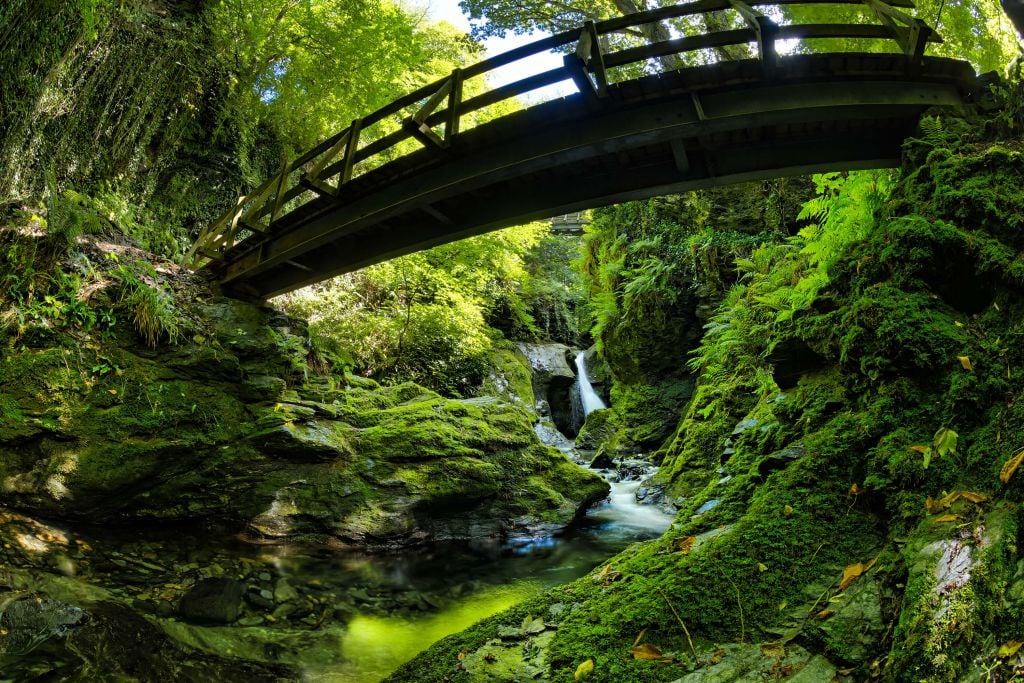Large bridge over waterfall