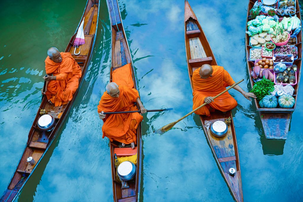 Monk in wooden boat