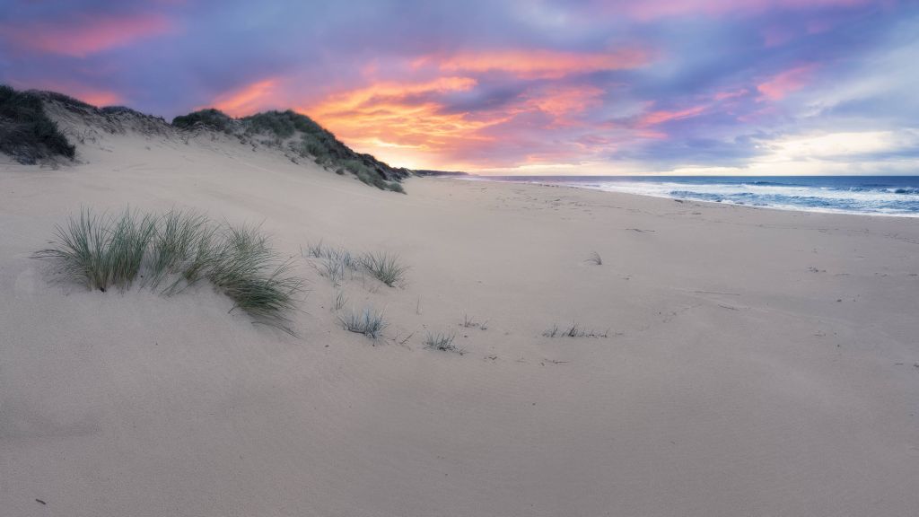 Sunrise over sand dunes