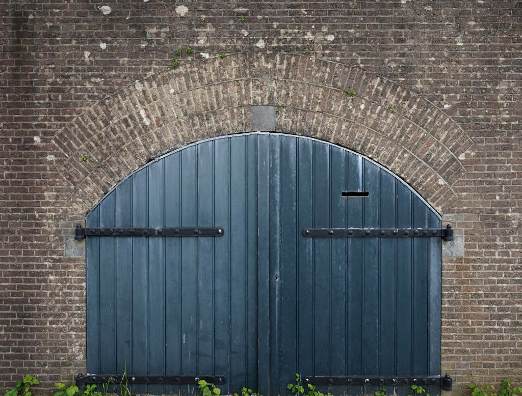 Brick wall with wooden doors