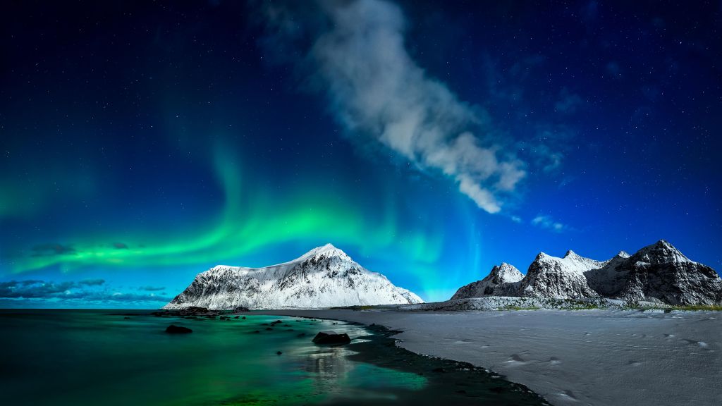 Northern lights above mountains