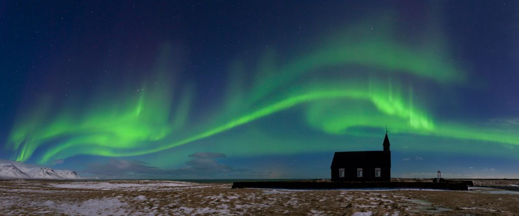 Northern lights above a church