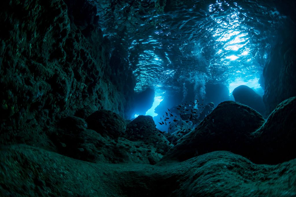 Sunbeams in underwater cave