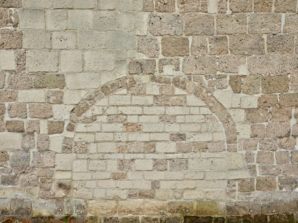 Old stone wall with arch