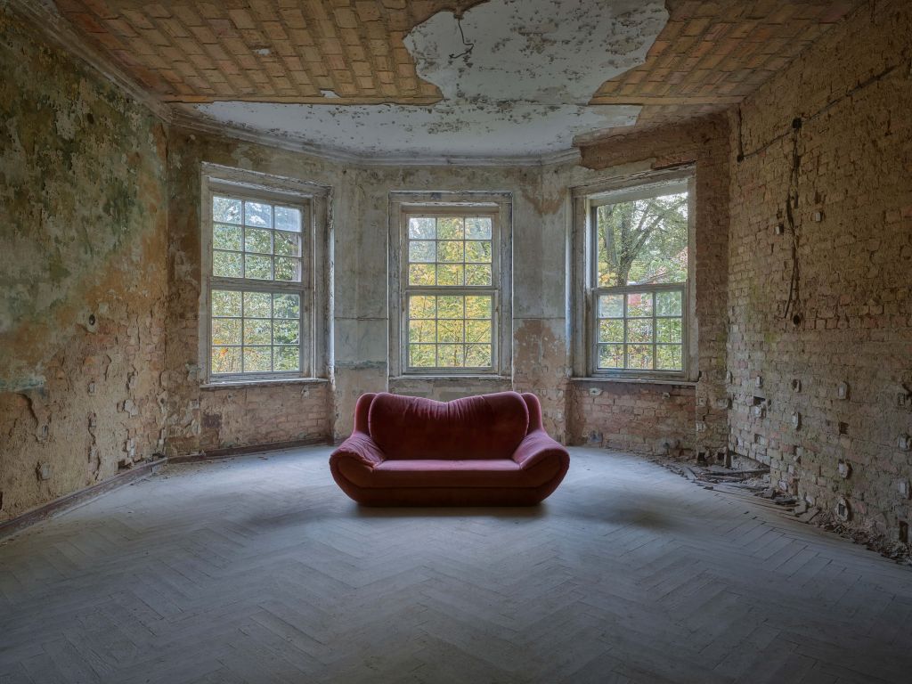 Sofa in abandoned room