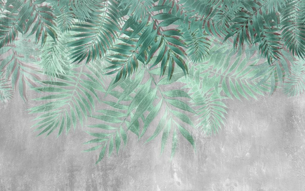 Green palm leaves with gray concrete wall