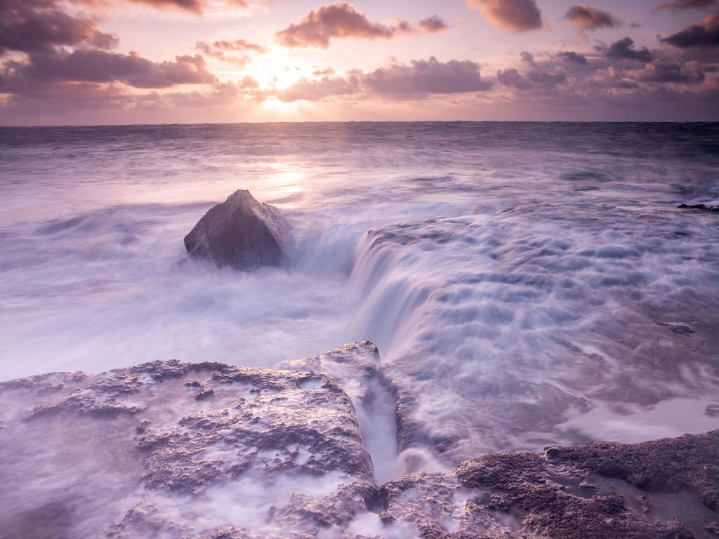 Wild sea at sunset