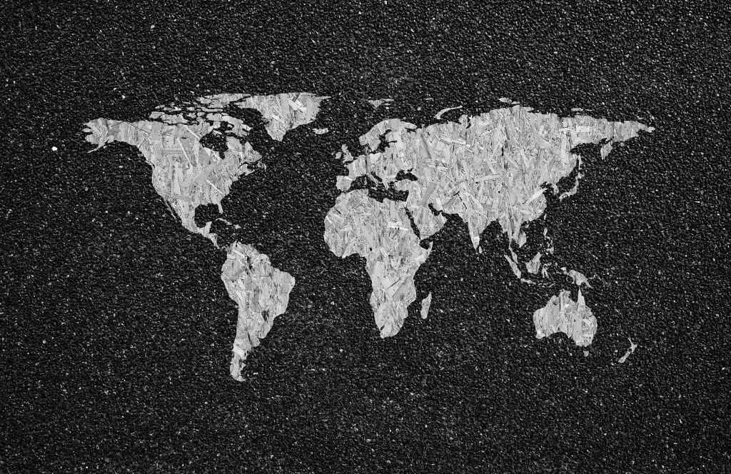 White world map on black background