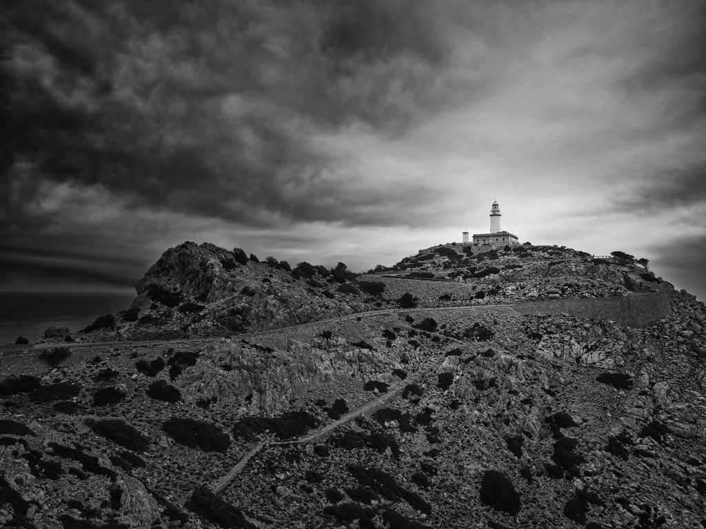 Lighthouse on the coast in black and white