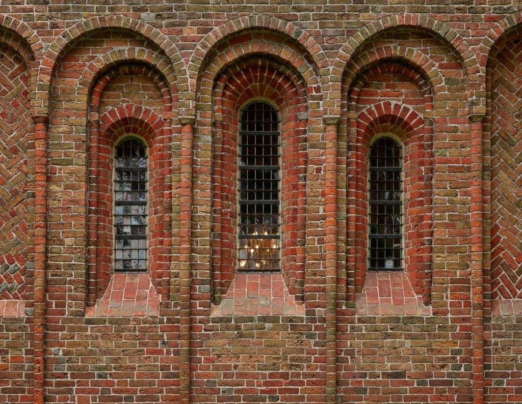 Brick wall with arches and windows