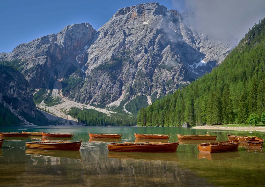 Wooden boats in mountain lake
