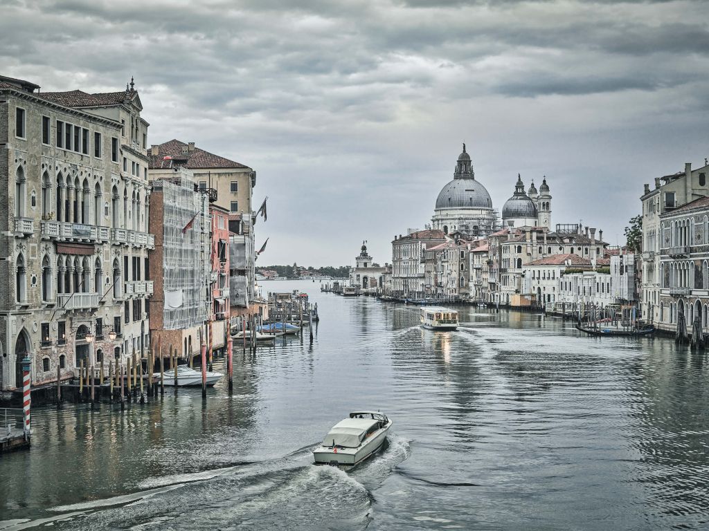 Canal with boats in Venice