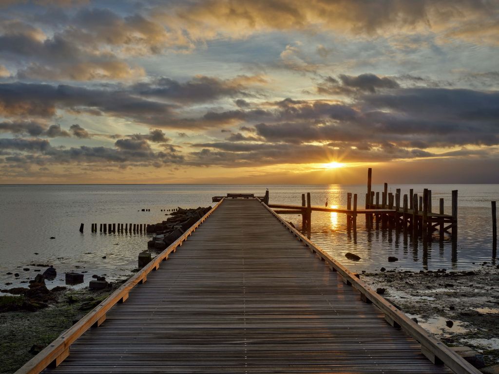 Wooden jetty with sunrise