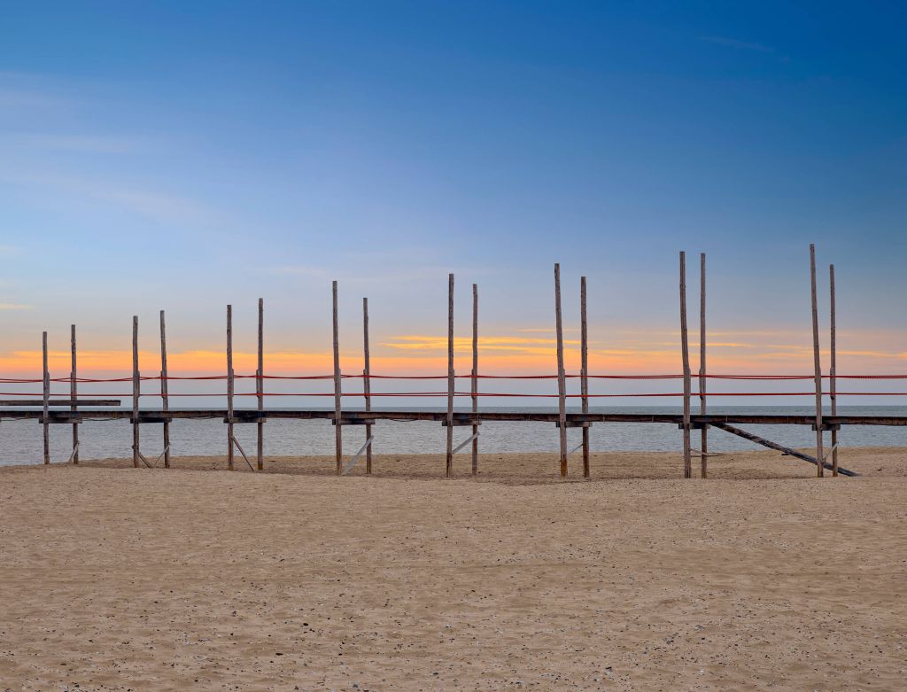 Long jetty with wooden posts