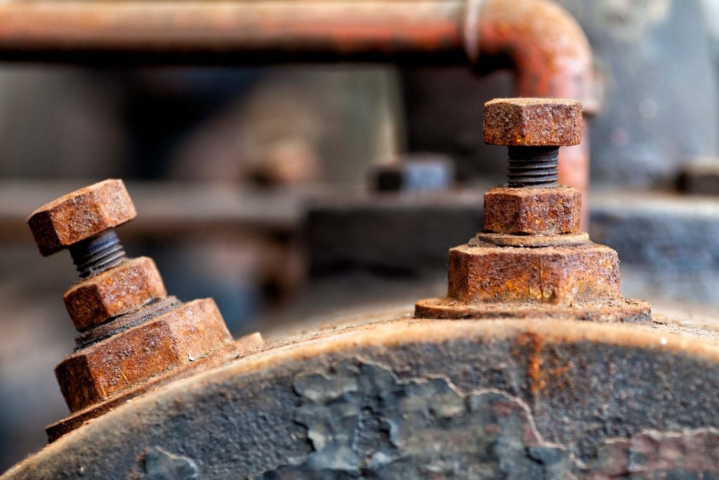 Detail of a rusted steam boiler (B)