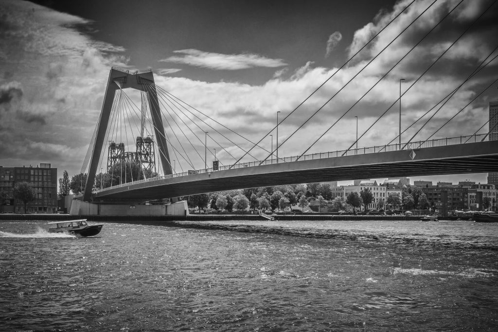 Passing the Prince Willem Alexander Bridge in Rotterdam in black and white  