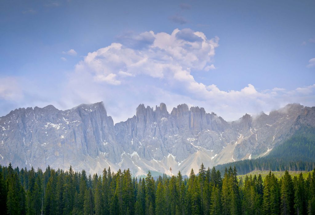 Mountains with trees and clouds