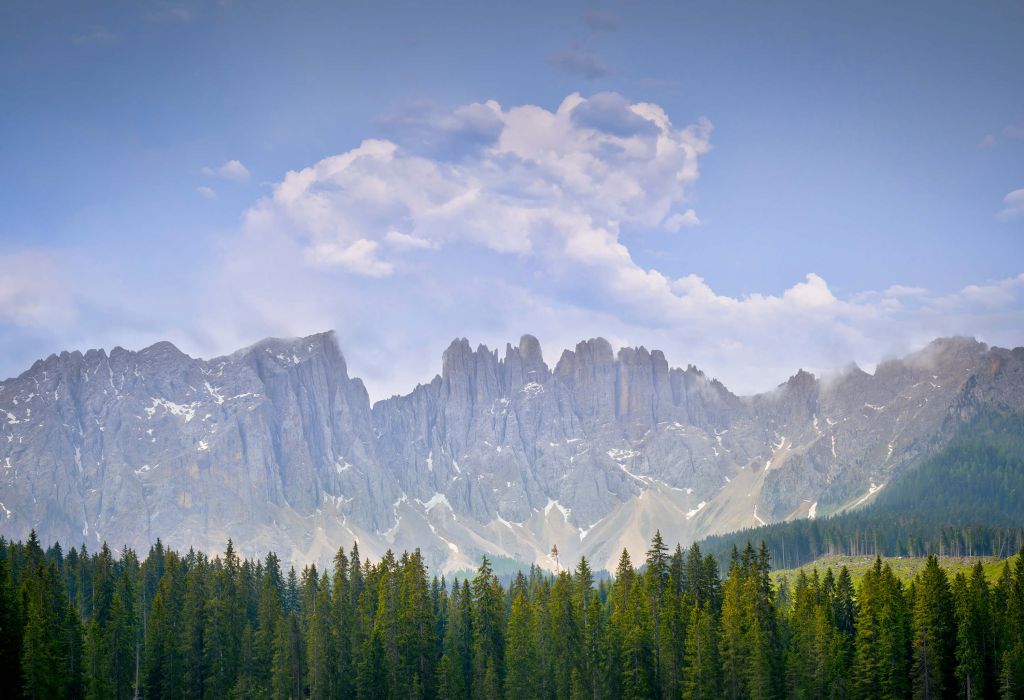 Mountains with trees and clouds