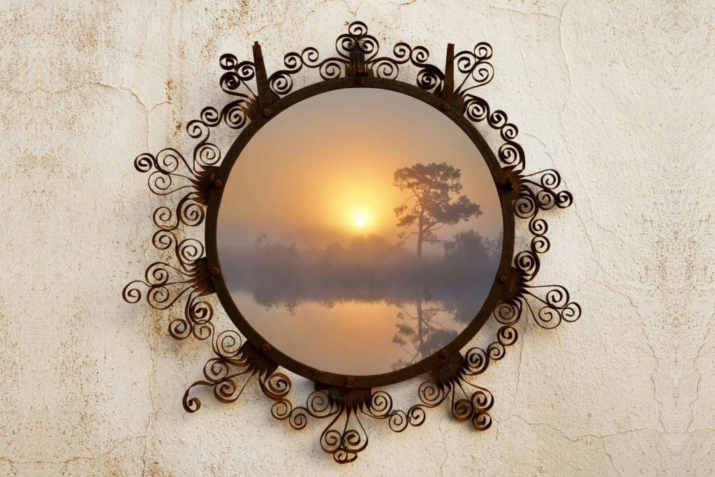 Sunrise over misty lake