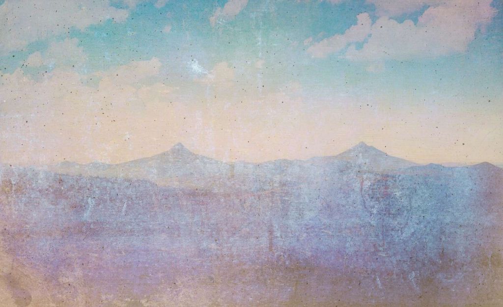 Fading mountain landscape in morning light