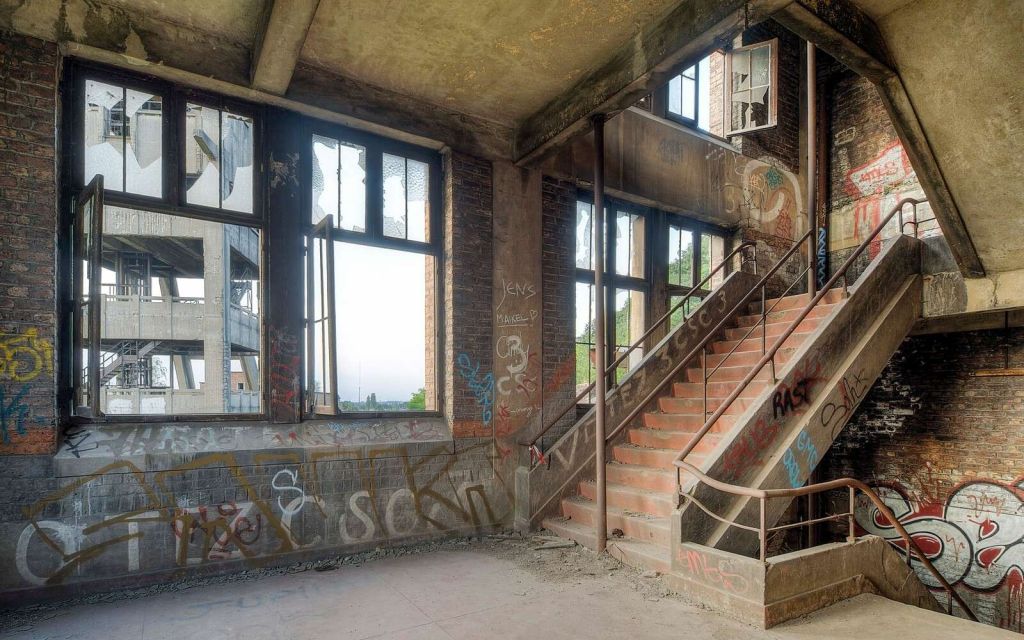 Dilapidated stairwell with graffiti