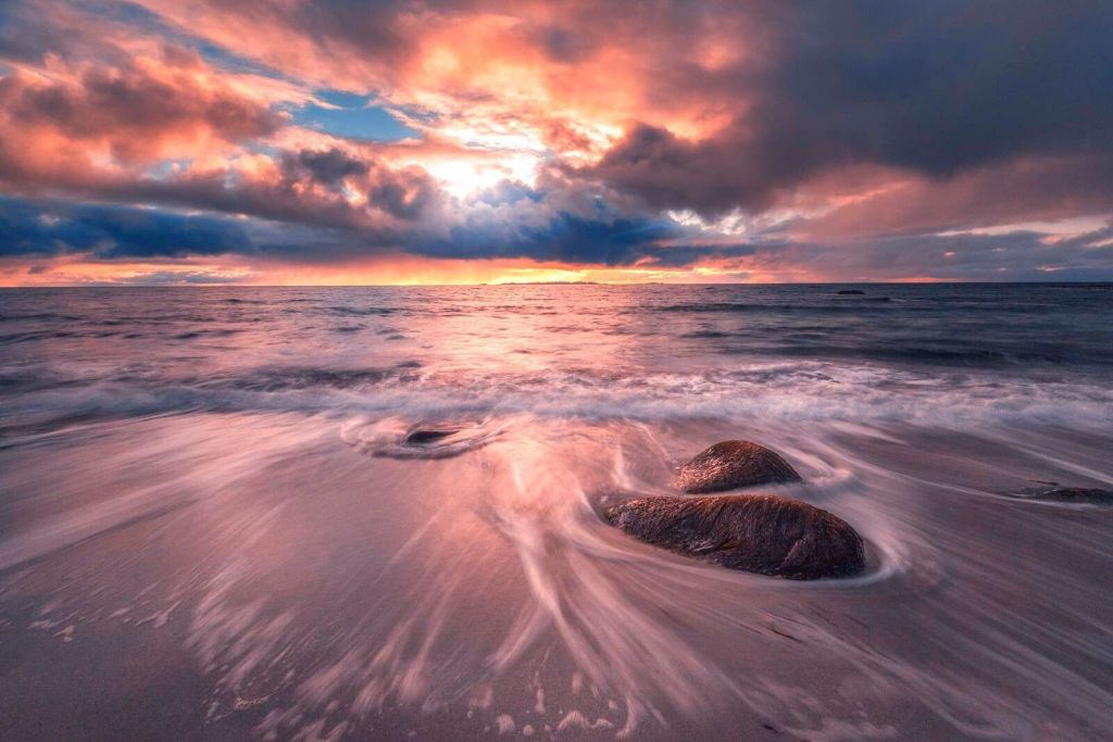 Storm clouds above calm waves