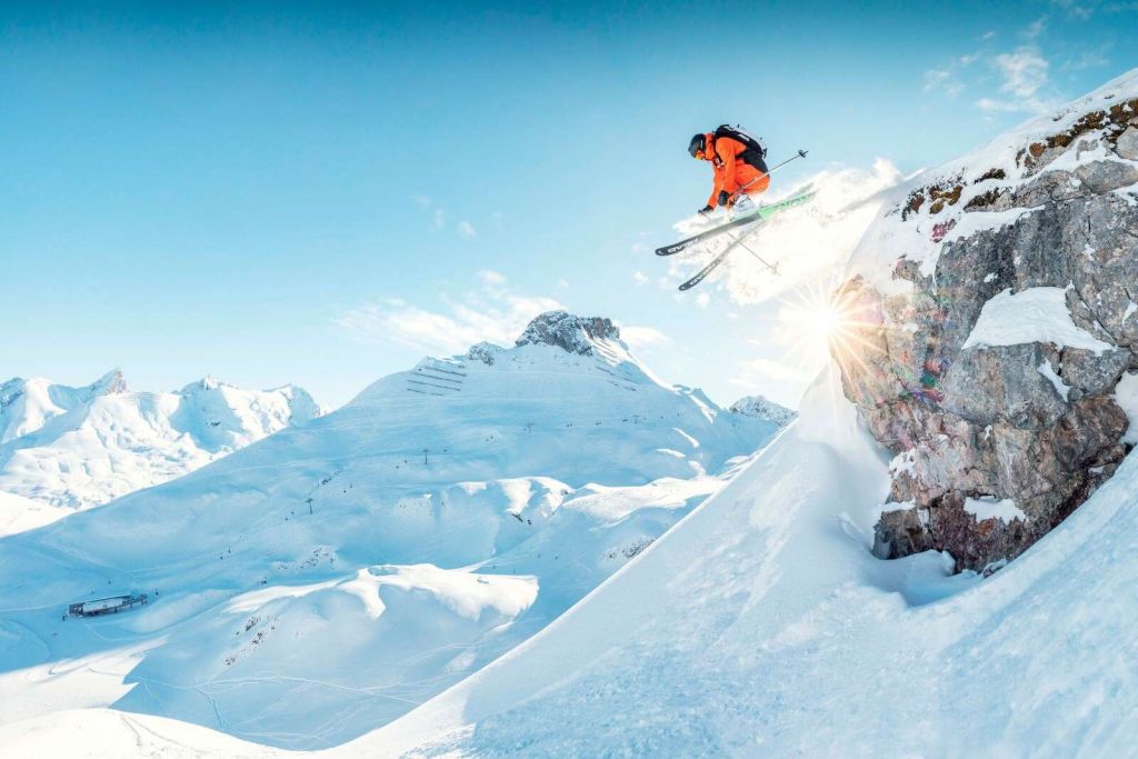 Jump in snowy mountain landscape