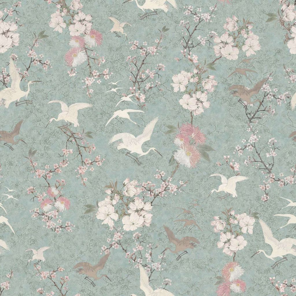 Cranes in a mint-green blossom garden