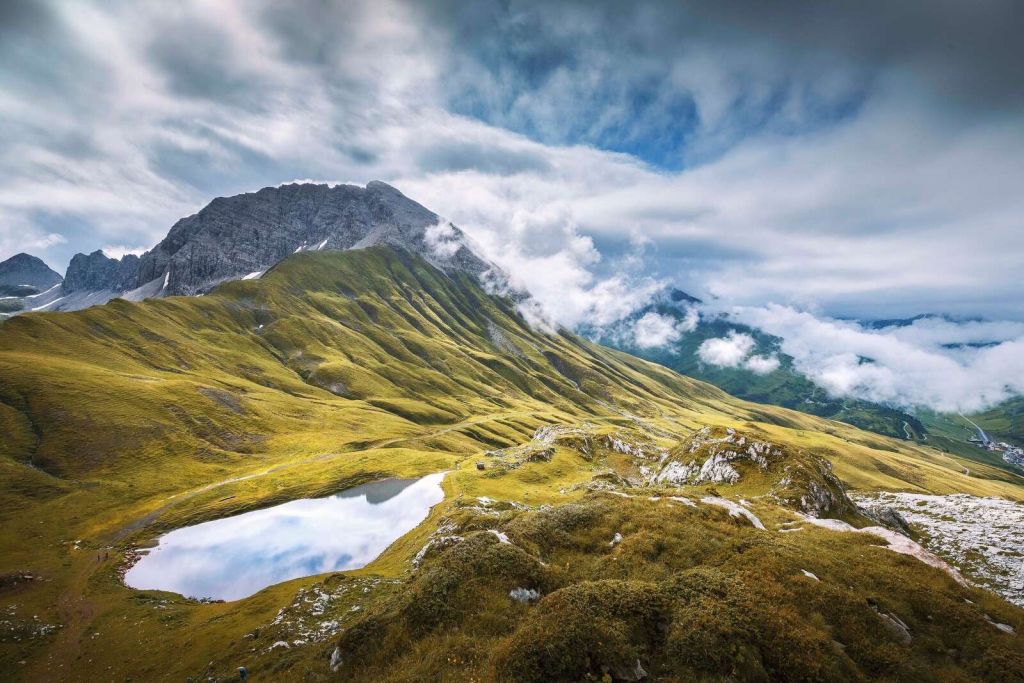 Mountain landscape with clouds and mountain lake