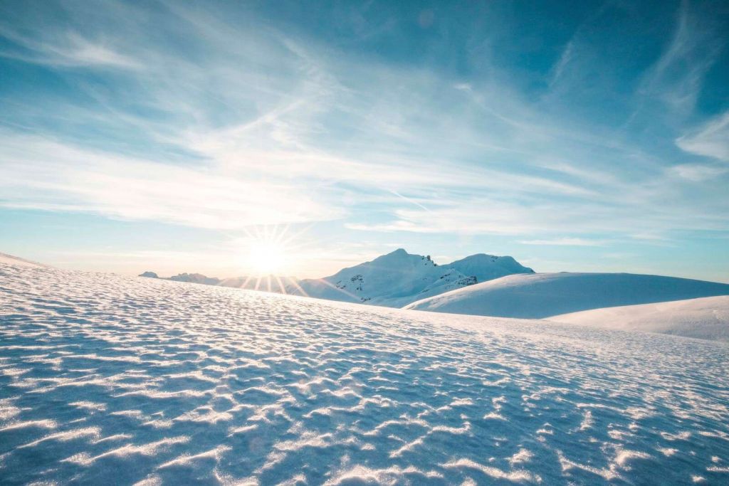 Morning sun over glistening snow fields