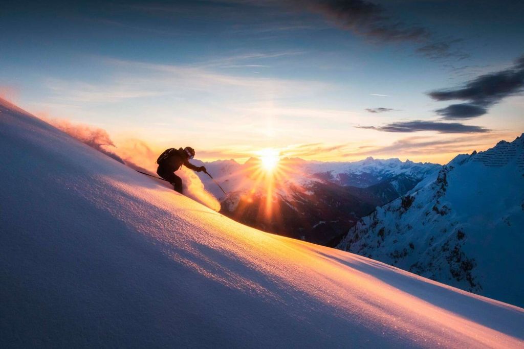 Skier in the fiery mountain sun