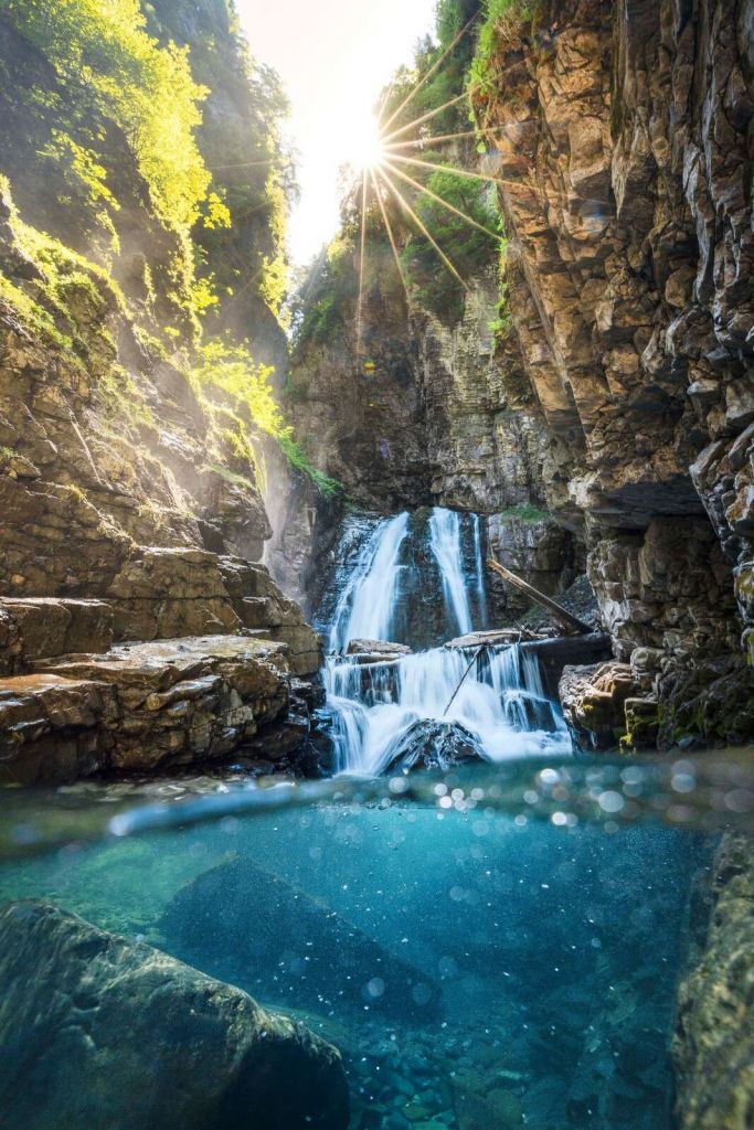 Sunlight On Mountain Waterfall