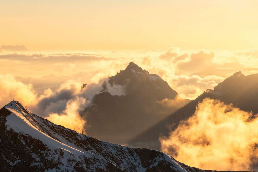 Sunrise Above Mountain Clouds