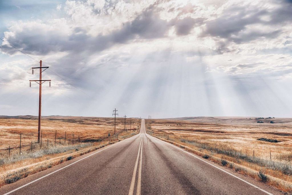 Endless Road Through Dry Grassland