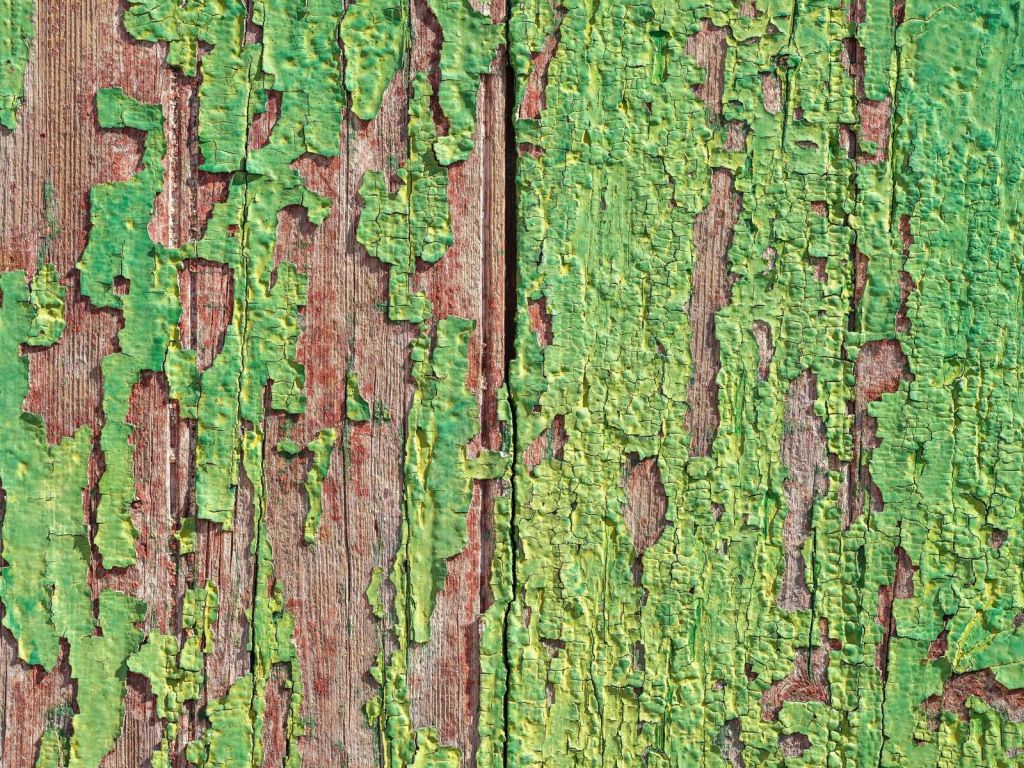 Weathered wood with a green paint layer