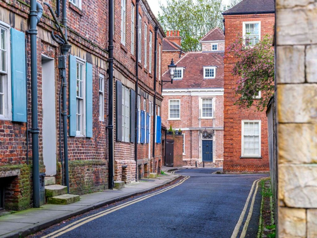 Narrow street with brick facades