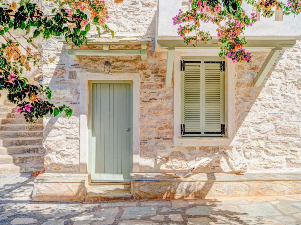 Mediterranean stone facade with bougainvillea