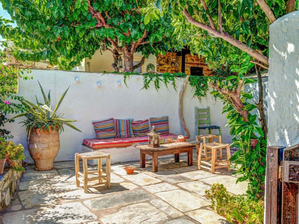 Mediterranean patio with colorful cushions