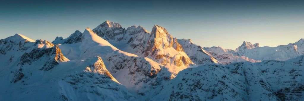 Winter sun on mountain peaks