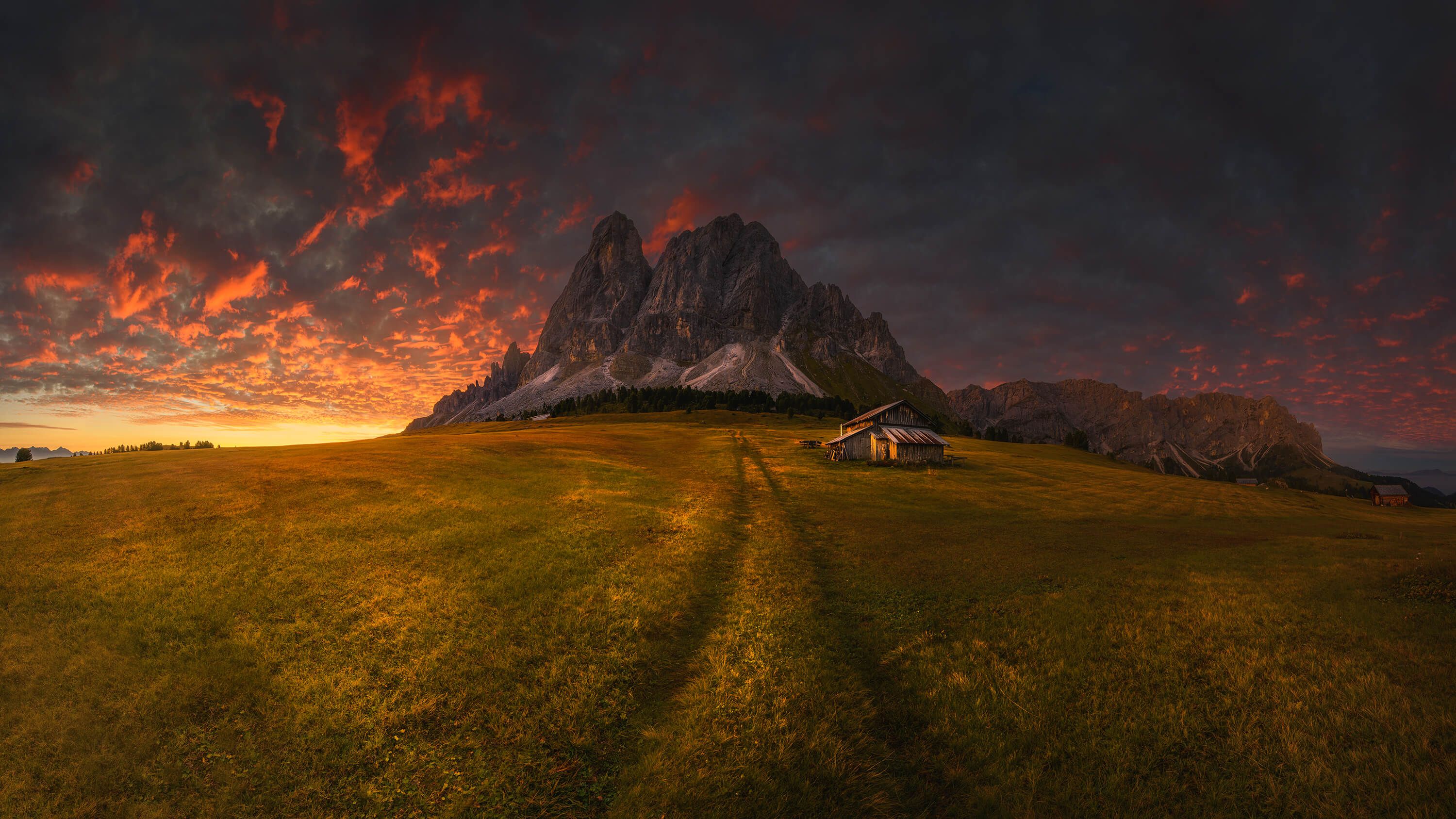 Sunset by a mountain Sunset by a mountain
