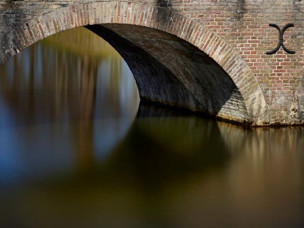 Old arch bridge to castle